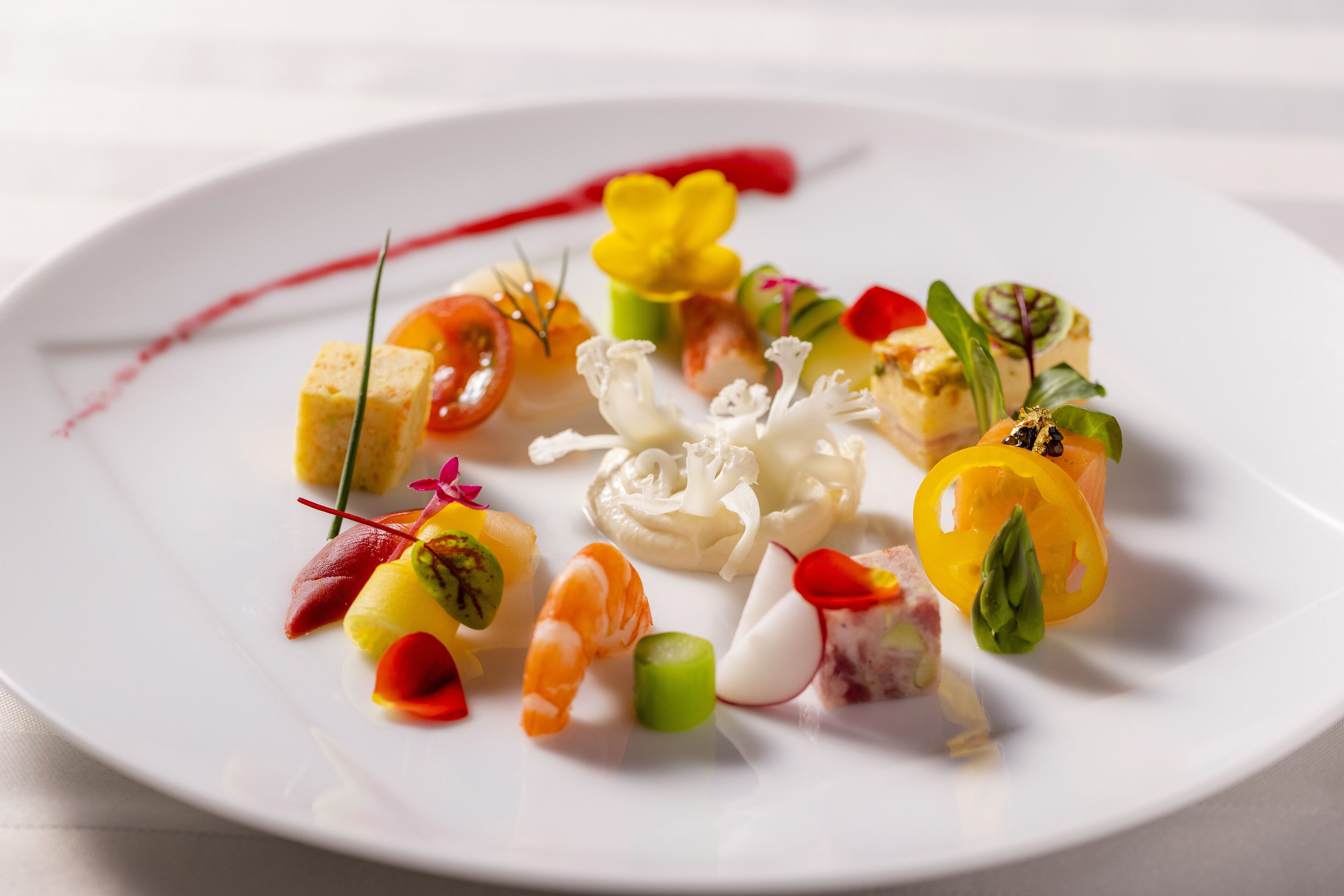 A white plate with various food items and garnishes.