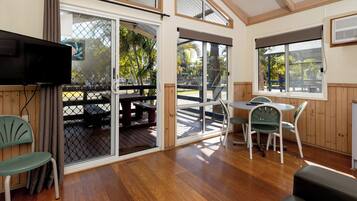 Standard Poolside 2 Bedroom Villa | Living area | Flat-screen TV, ping pong, books