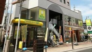 A multi-story building with a flat facade, several windows, and a covered entrance area. - Hotel Select Inn Nagano (Nagano)