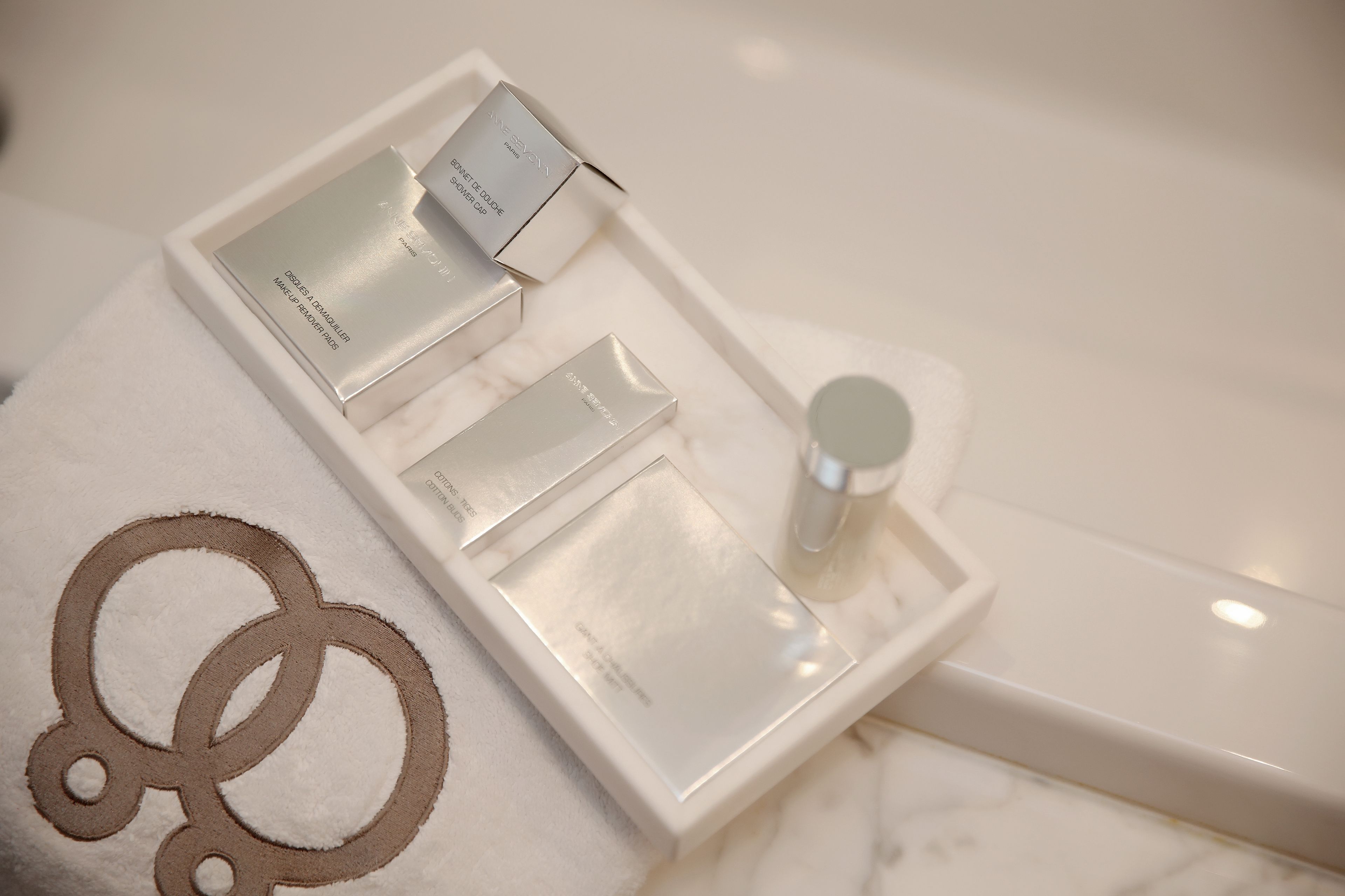 designer toiletries, hair dryer, bathrobes, slippers