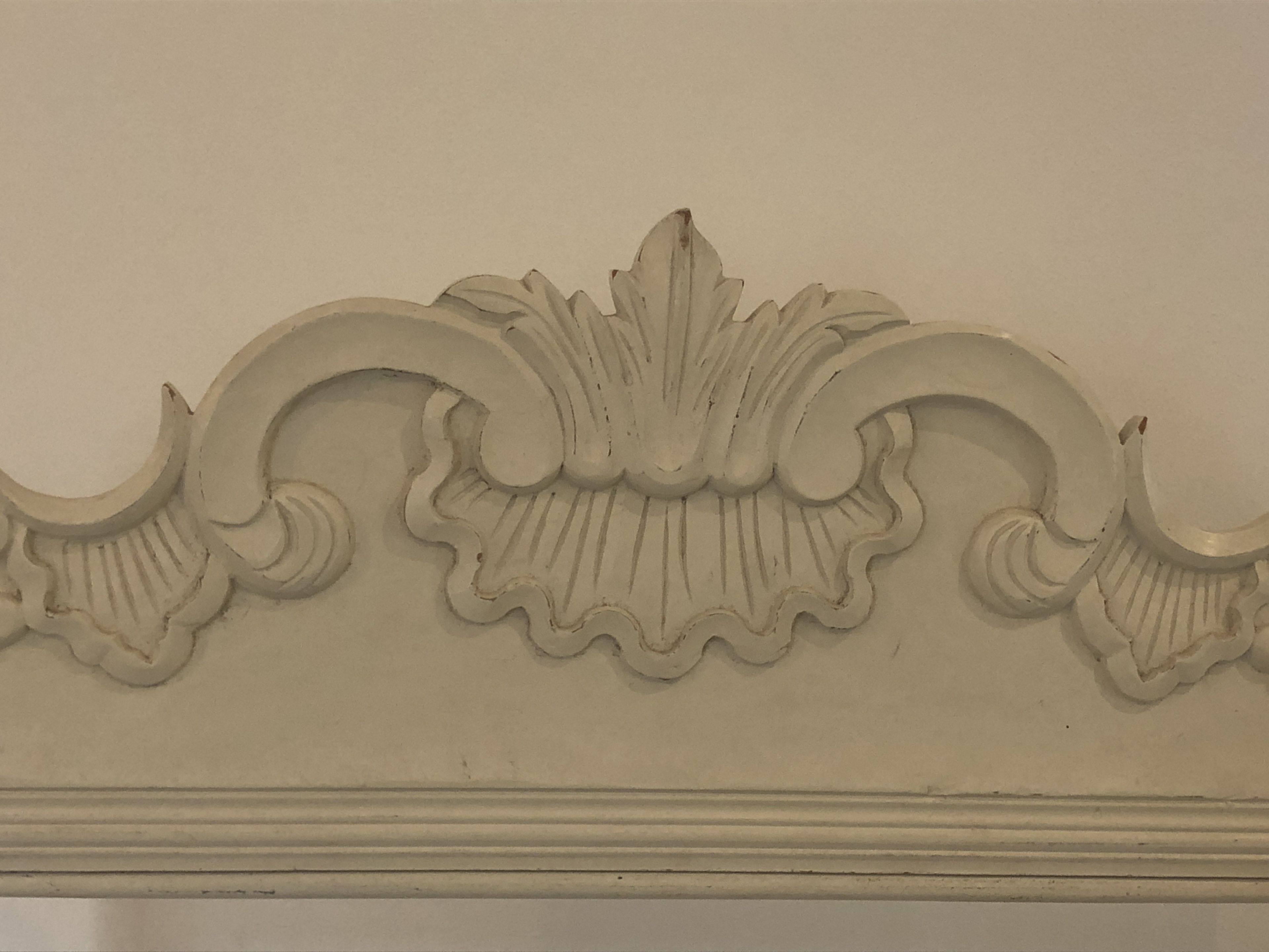 A detailed architectural molding with a symmetrical design.