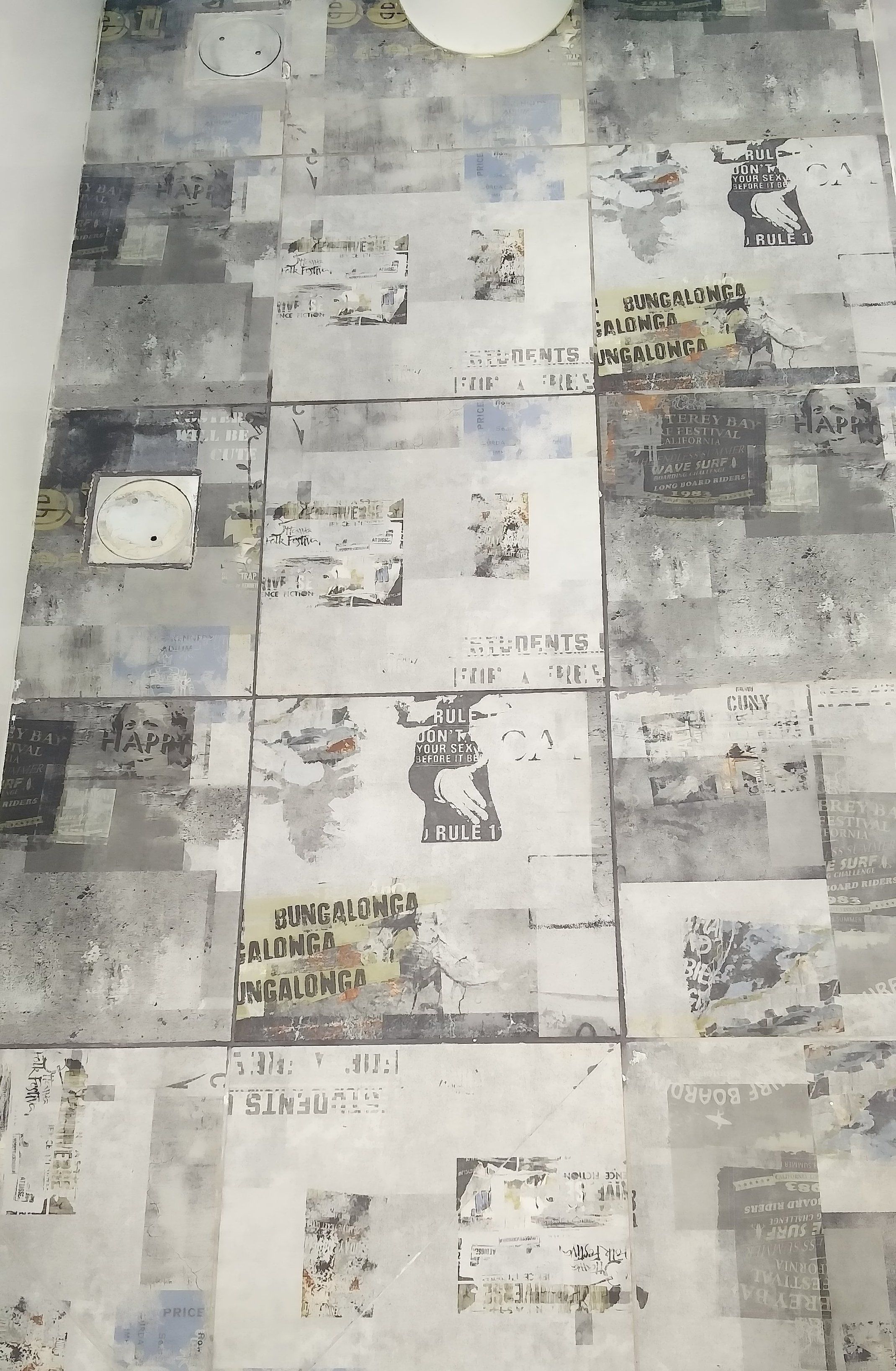 A wall covered with various posters and advertisements.