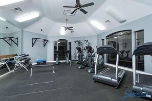 A gym with treadmills, elliptical machines, and free weights. - Restful By Signature Vacation Rentals (Scottsdale)