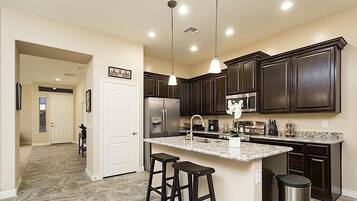 Condo, 4 Bedrooms | Private kitchen | Fridge, microwave, coffee/tea maker