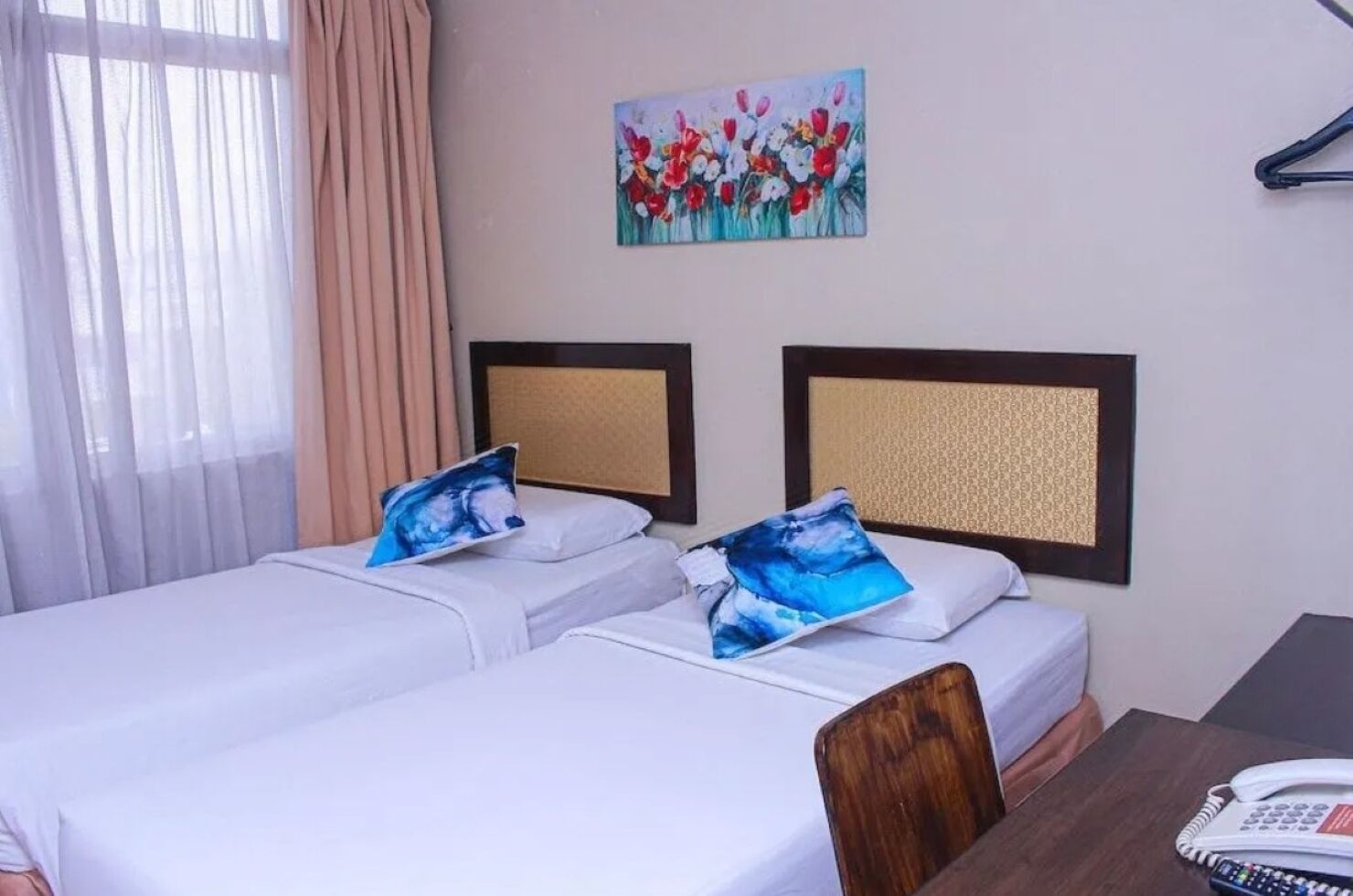 Premium bedding, desk, laptop workspace, iron/ironing board