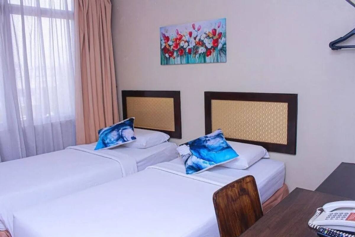 Premium bedding, desk, laptop workspace, iron/ironing board