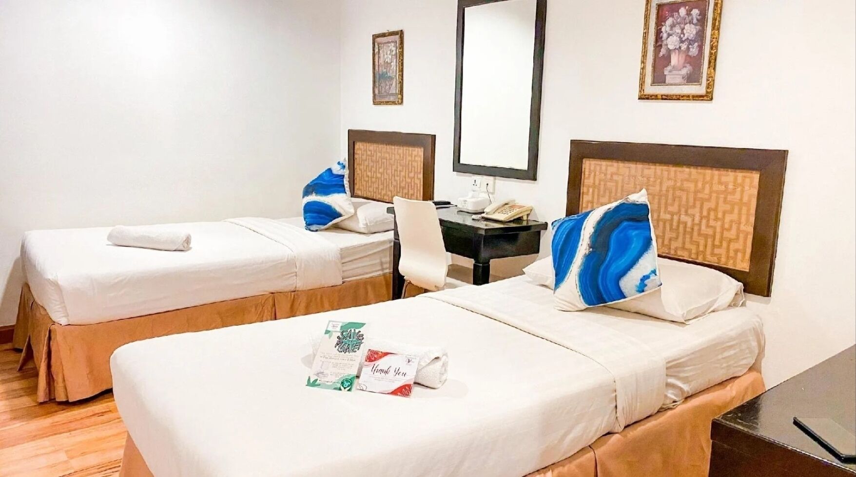 Premium bedding, desk, laptop workspace, iron/ironing board