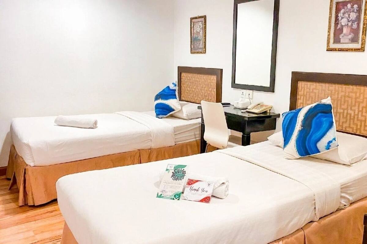 Premium bedding, desk, laptop workspace, iron/ironing board