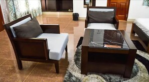 Habitación familiar | Zona de estar | Una televisión de pantalla plana