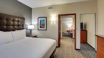 Desk, laptop workspace, blackout drapes, iron/ironing board