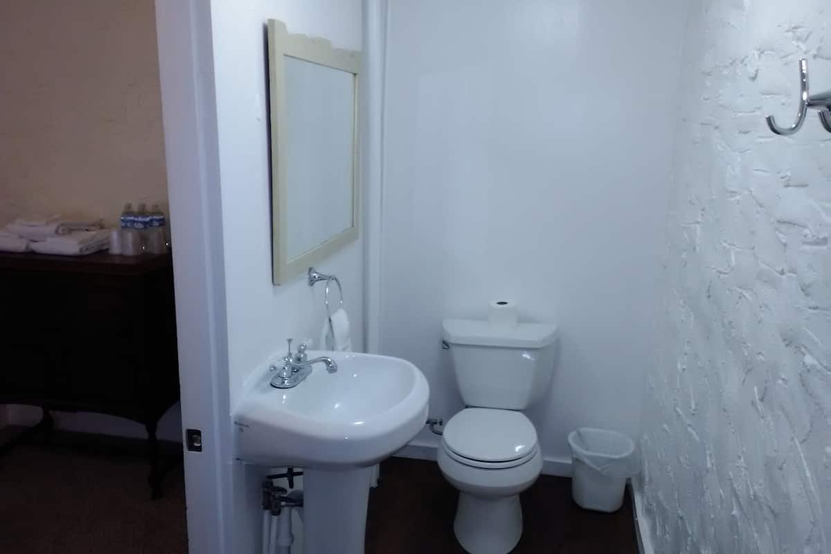 family suite, multiple beds, refrigerator & microwave, courtyard area | bathroom | hydromassage showerhead, free toiletries, towels, soap