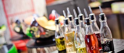 A bar with various bottles of alcohol, including whiskey and vodka, on a counter.