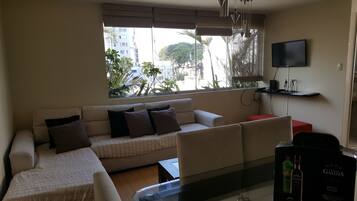 Apartment, 3 Bedrooms | Living room | 30-inch flat-screen TV with cable channels, TV