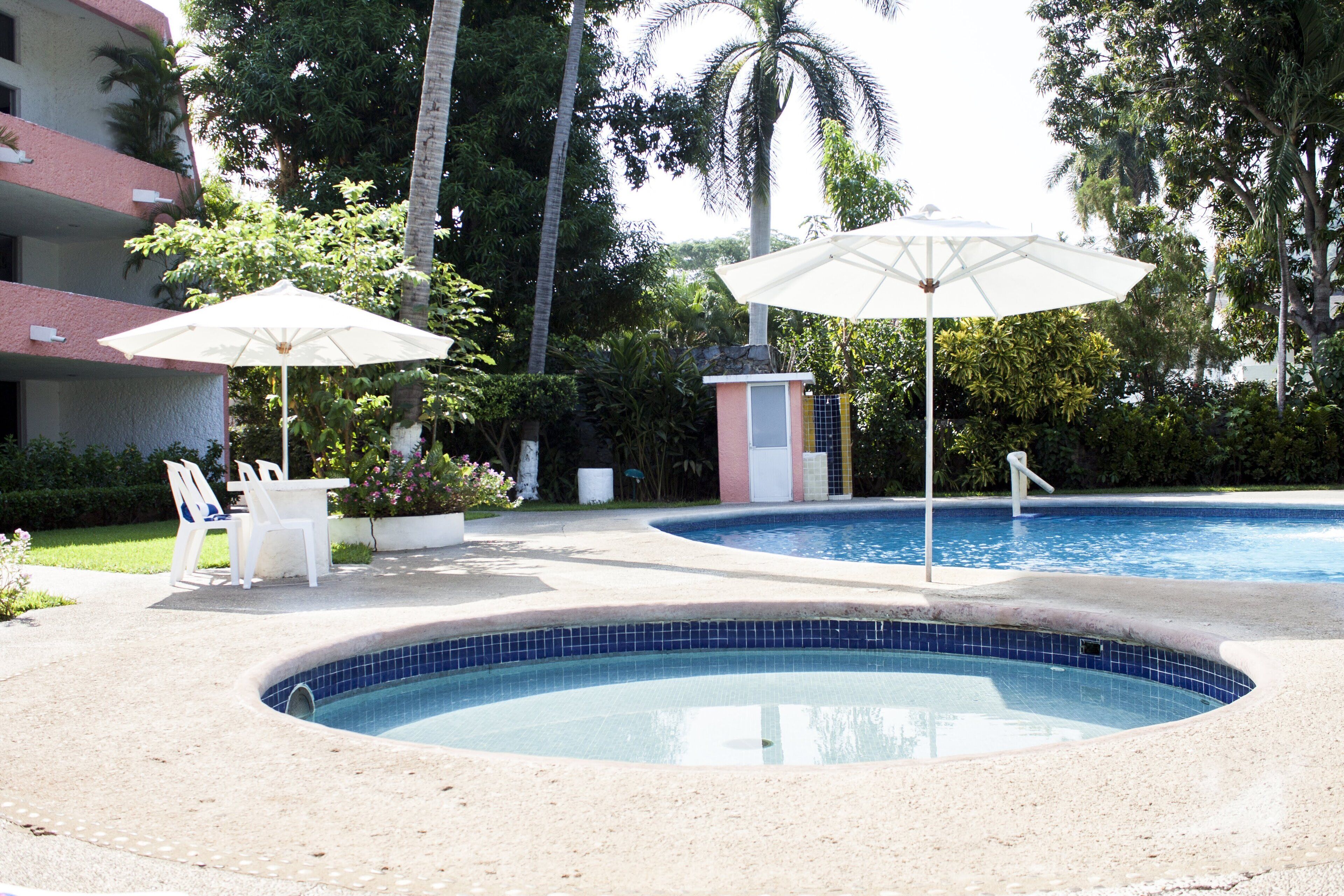 outdoor pool, open 8:00 am to 8:00 pm, pool umbrellas, pool loungers