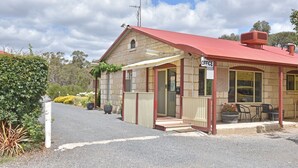 A small building with a red roof and a sign that reads "OFFICE". - Inglewood Motel and Caravan Park (Inglewood)