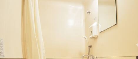 A bathroom with a toilet, sink, and bathtub.