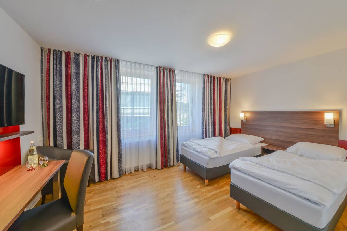double or twin room | living area | 85-cm flat-screen tv with satellite channels, tv