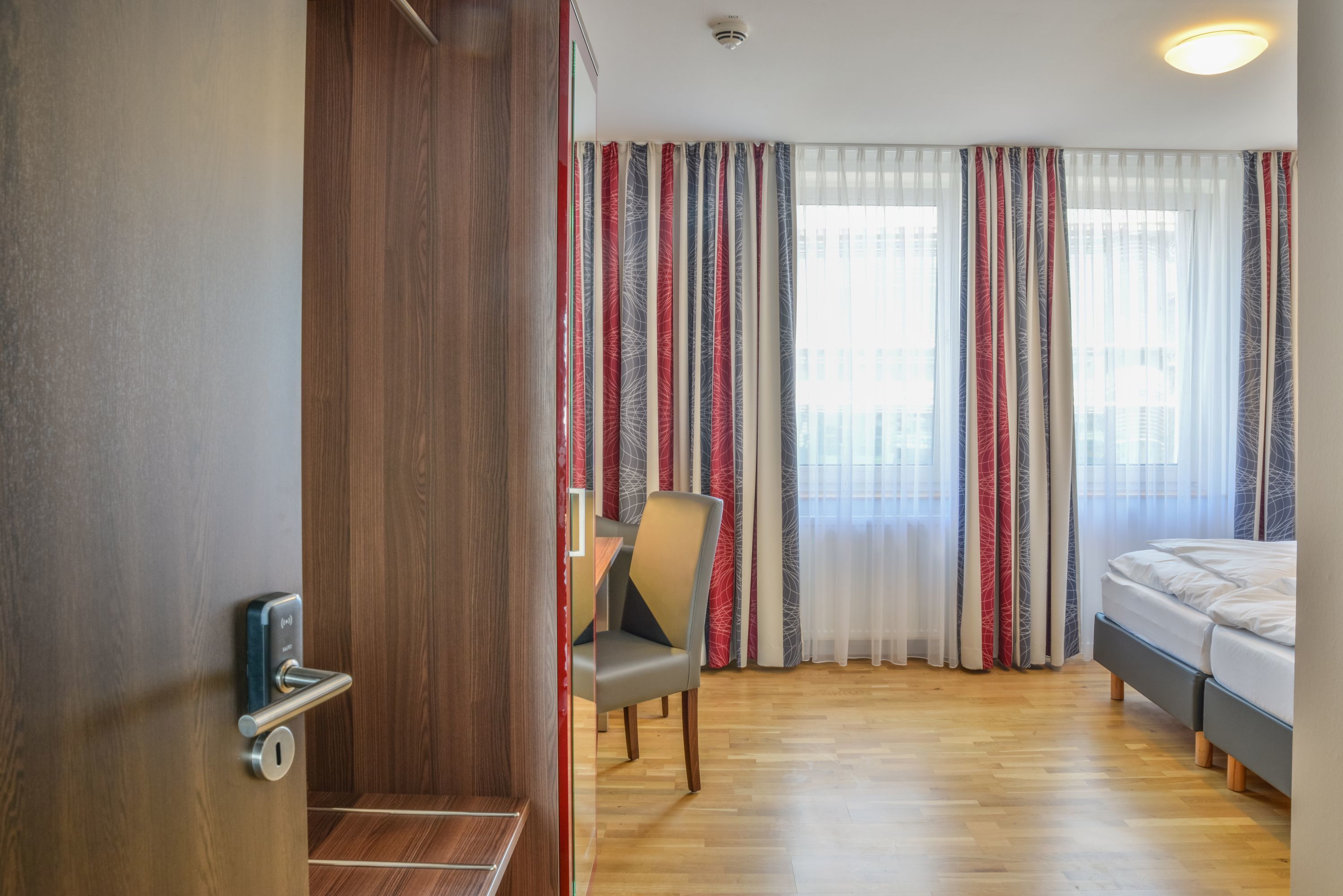 double or twin room | living area | 85-cm flat-screen tv with satellite channels, tv