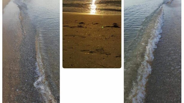 A beach scene with calm waters and a distant mountain. - Happy Resort (Khanom)