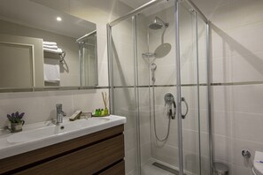 Shower, free toiletries, hair dryer, slippers