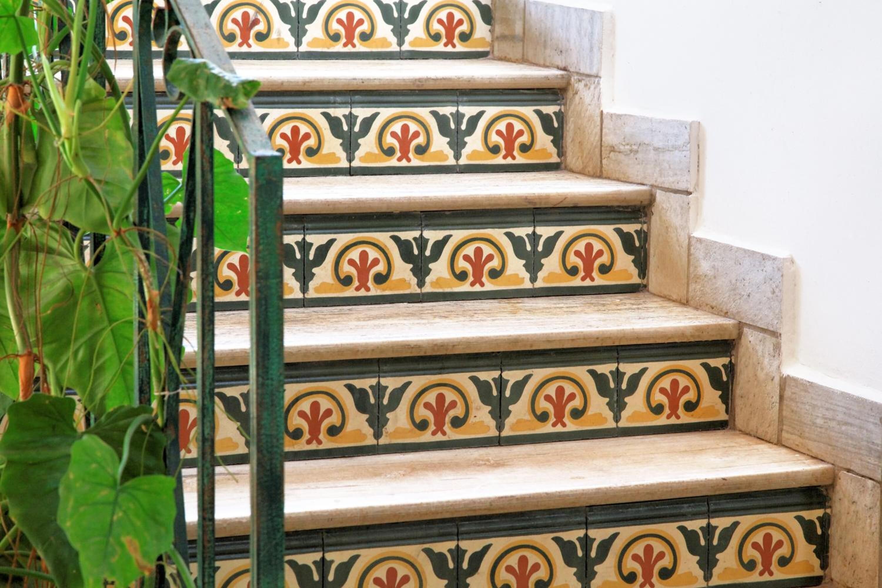 A staircase with ornate, patterned tiles.