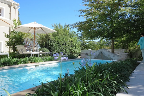 Outdoor pool, pool umbrellas, sun loungers