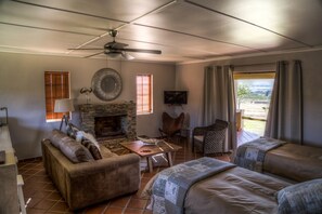 Comfort Cottage, 1 Bedroom (Self-Catering Cottage) | Living area | Flat-screen TV - Kwetu Guest Farm (Swellendam)