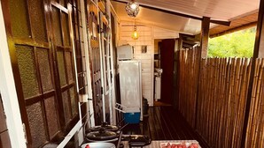A breakfast setup with food, drinks, and kitchen appliances. - Pousada Boldro Home (Fernando de Noronha)