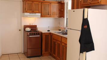 Apartment, 2 Bedrooms | Private kitchen | Full-size fridge, oven, cookware/dishes/utensils