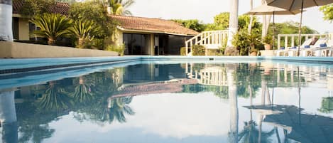 Outdoor pool, open 8:00 AM to 8:00 PM, pool umbrellas, sun loungers