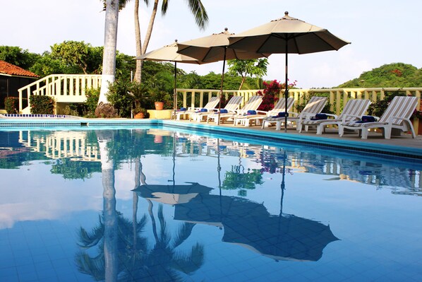 Outdoor pool, open 8:00 AM to 8:00 PM, pool umbrellas, sun loungers