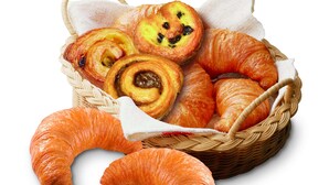 A basket of assorted pastries including croissants and a brioche with a visible filling. - Setouchiso (Sakaide)