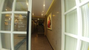 A hotel entrance with a reception desk, a staircase, and a framed artwork on the wall. - Hotel Gaon Insa-dong (Seoul)