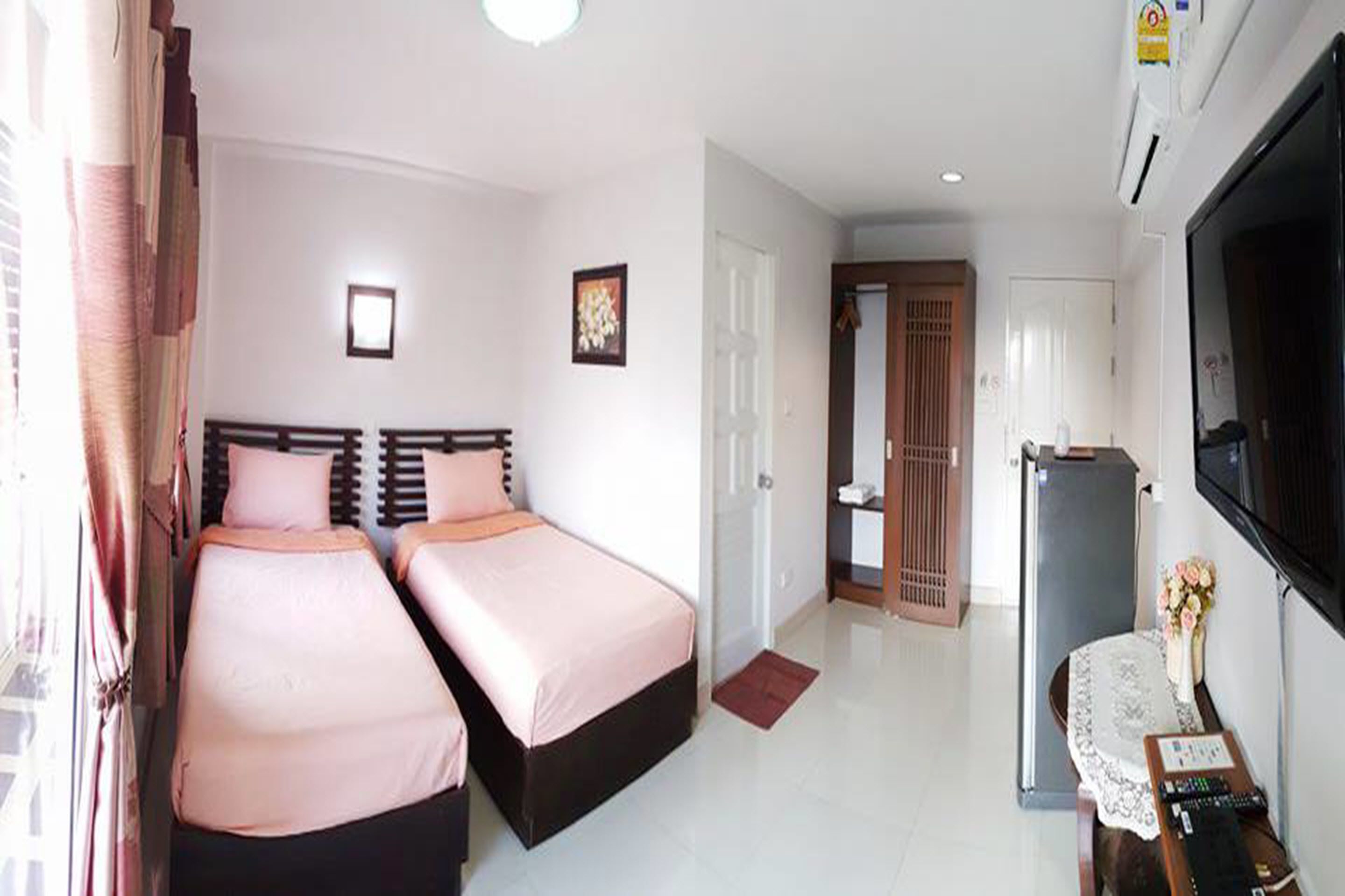 Twin Bed | Blackout drapes, free WiFi, bed sheets