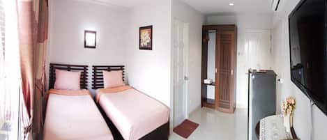 Twin Bed | Blackout drapes, free WiFi, bed sheets