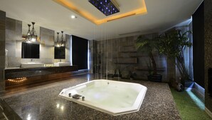 A modern bathroom with a large bathtub, granite countertops, and a mirror with dual sinks. - OHYA Chain Boutique Motel-Yongkang (Tainan)