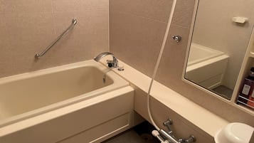 Shower, free toiletries, hair dryer, slippers