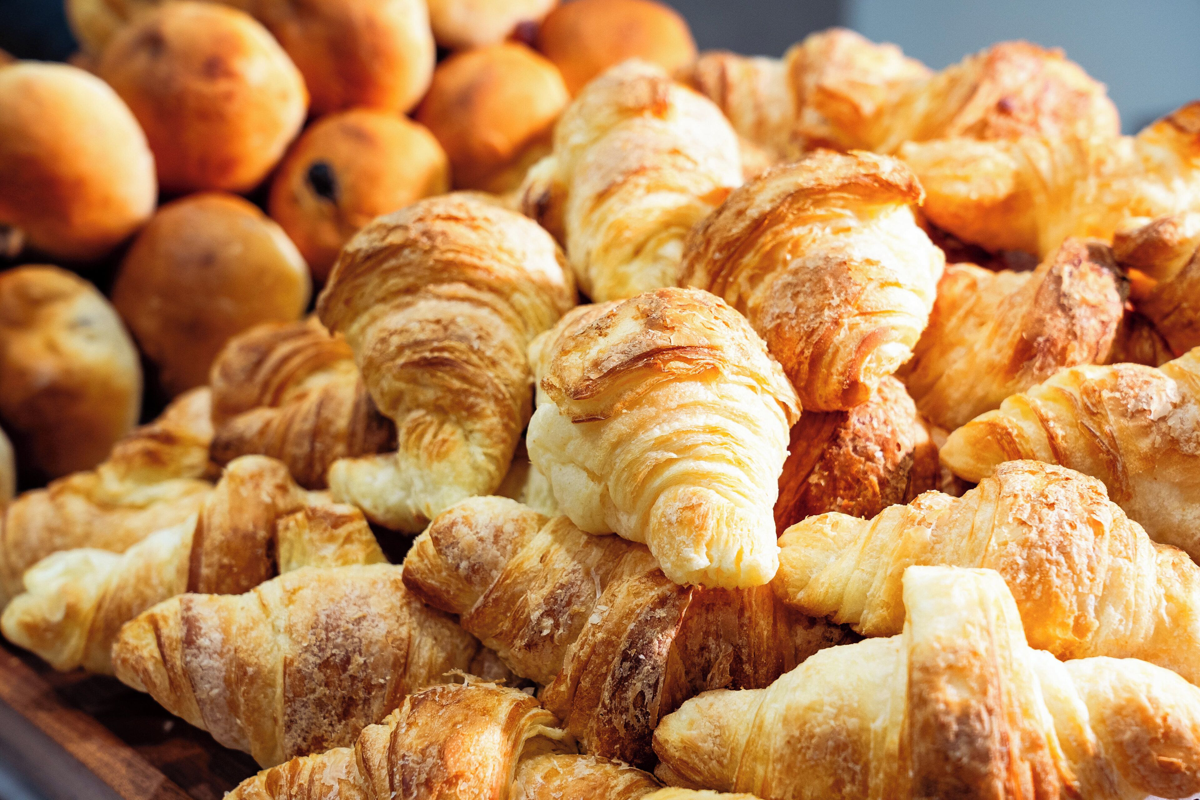 A variety of pastries including croissants and other baked goods.