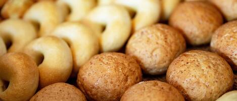 A variety of round, textured bread rolls.