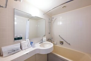 A bathroom with a sink, mirror, and bathtub. - ANA Holiday Inn Iwate Kitakami by IHG (Kitakami)