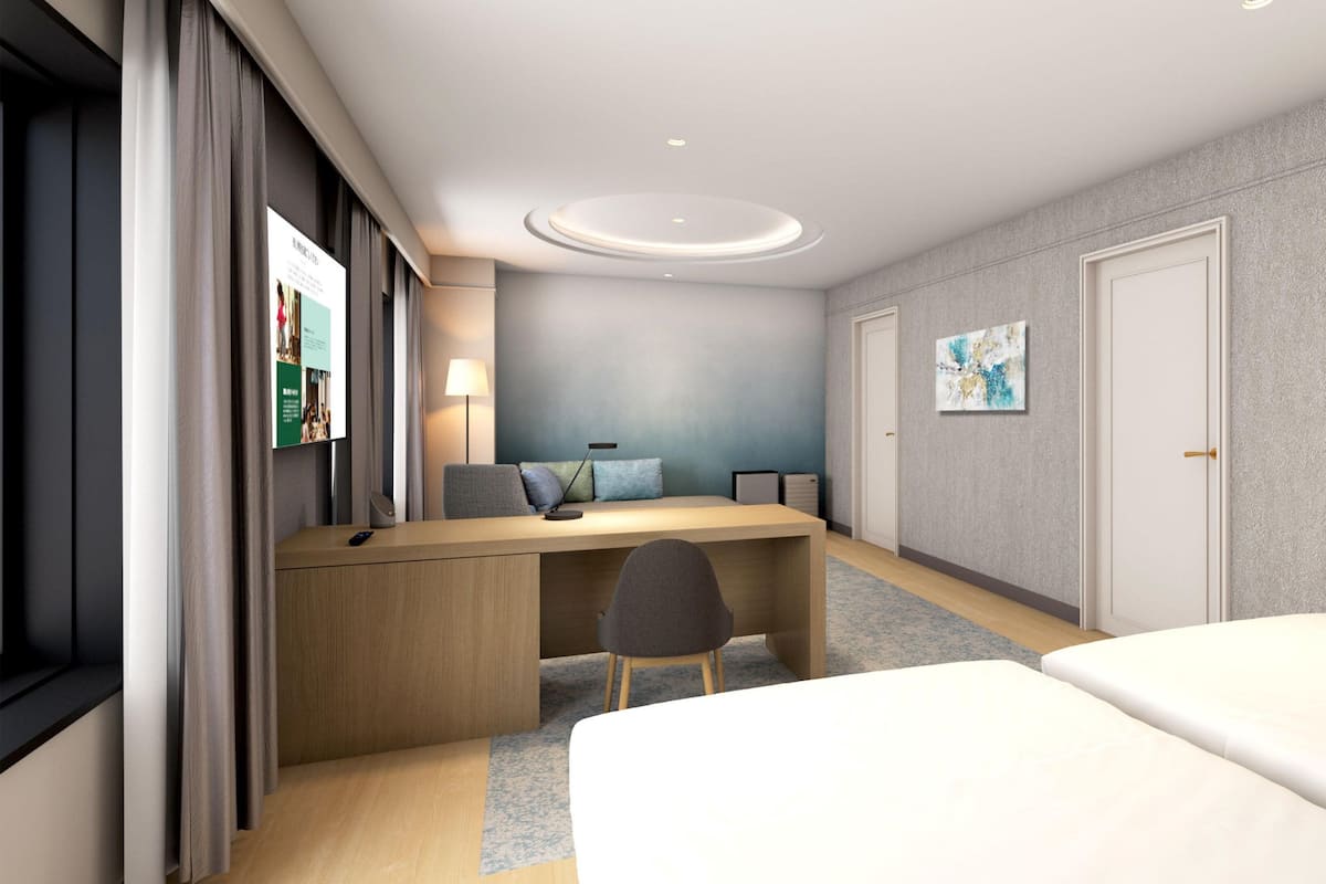 Suite, 2 Einzelbetten | 1 Schlafzimmer, Verdunkelungsvorhänge, kostenloses WLAN, Bettwäsche