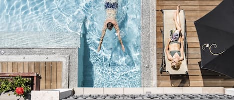 Indoor pool, outdoor pool, pool umbrellas, pool loungers