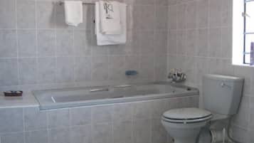 Bathtub, free toiletries, towels, soap