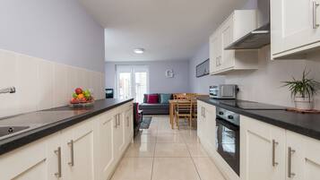 Superior Apartment, 2 Bedrooms | Private kitchen | Fridge, microwave, oven, stovetop