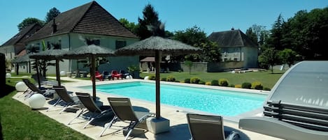 Outdoor pool, pool umbrellas, sun loungers