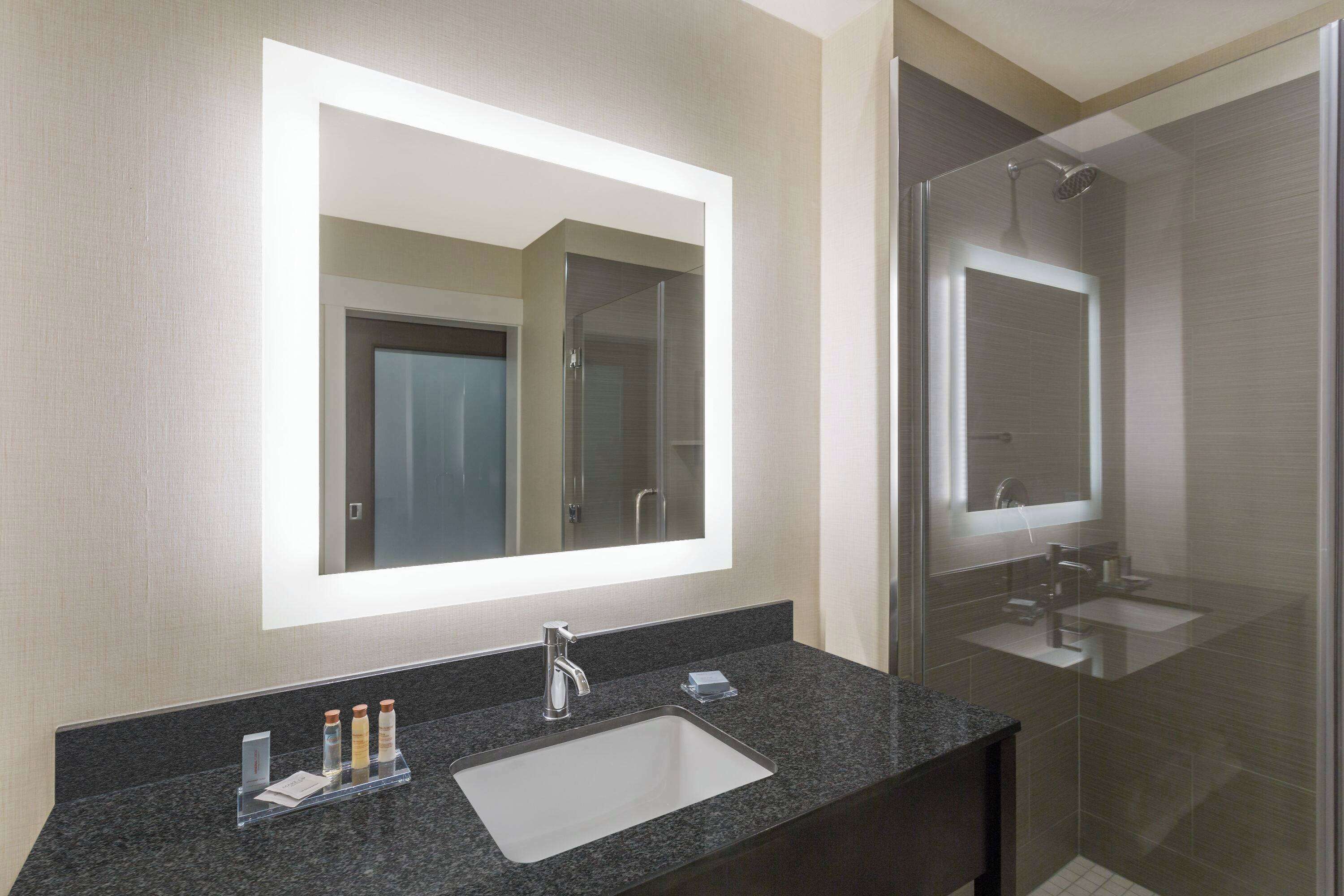 eco-friendly toiletries, hair dryer, towels