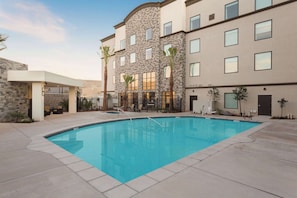 Seasonal outdoor pool, open 8:00 AM to 11:00 PM, sun loungers