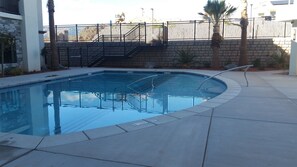 Seasonal outdoor pool, open 8:00 AM to 11:00 PM, sun loungers