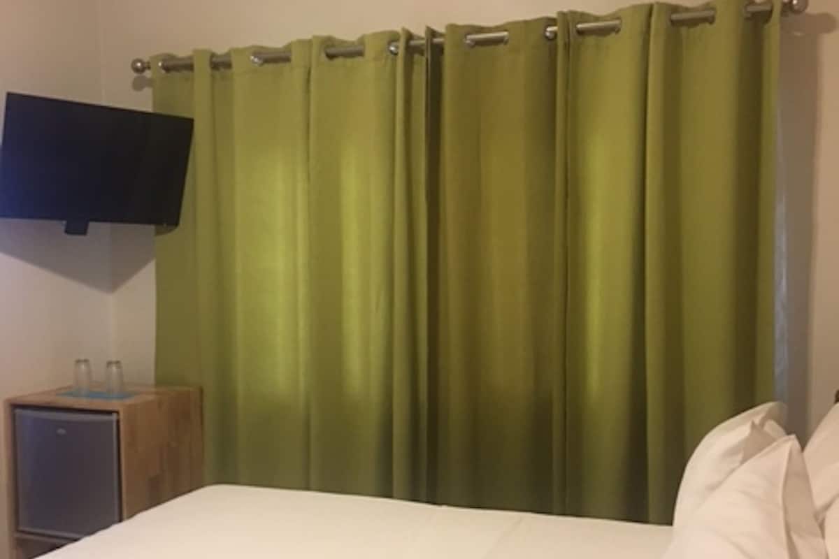Queen Room | In-room safe, individually decorated, blackout curtains