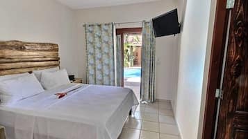 Poolside Quadruple Room | In-room safe, individually decorated, blackout drapes